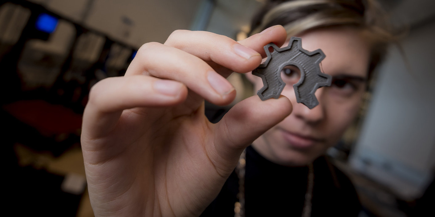 Person holding cog